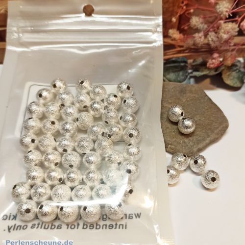 Set mit 50 Perlen Metallspacer Sternenstaub 8 mm silberfarben