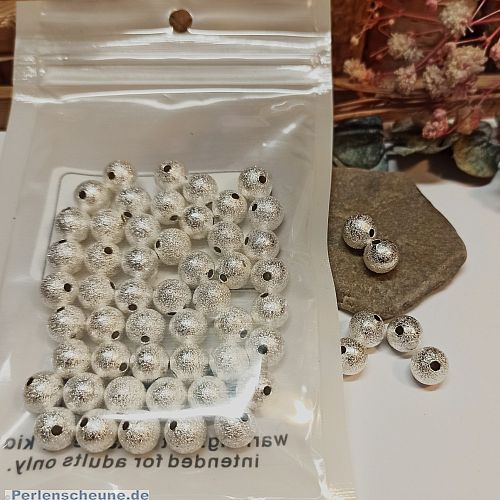 Set mit 30 Perlen Metallspacer Sternenstaub 6 mm silber